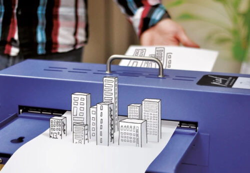 Illustration af PIAF Svulmemaskine som gør en tegning af bygninger taktil